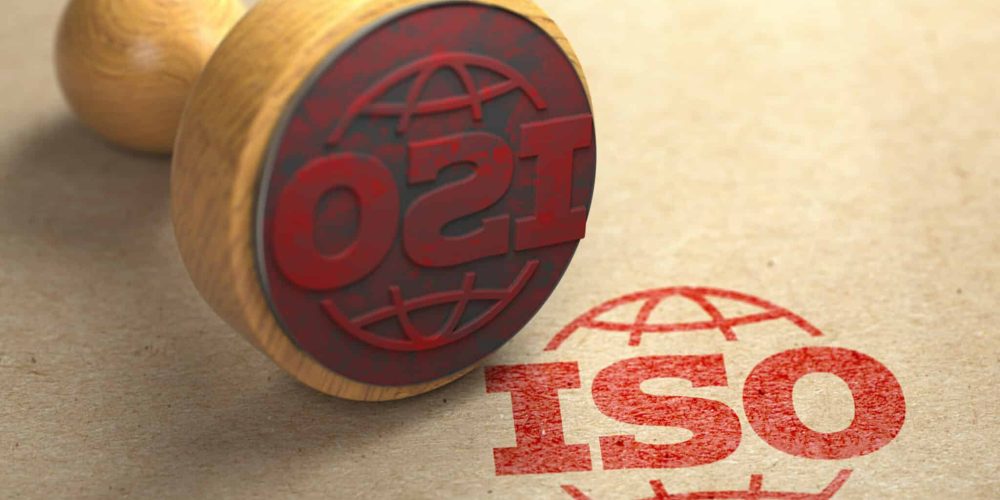 ISO 9001 certified concept. Rubber stamp with the text ISO 9001 on craft paper background. Quality control. 3d illustration